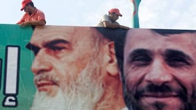 A billboard bearing a picture of Ayatollah Ruhollah Khomeini, the late founder of the Islamic republic, left, and the Iranian president Mahmoud Ahmadinejad is erected near Lebanon’s capital, Beirut, on Monday.