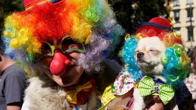 Clowns hit the streets. AFP