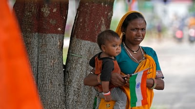 A roadside vendor sells tricolor flags. AP Photo