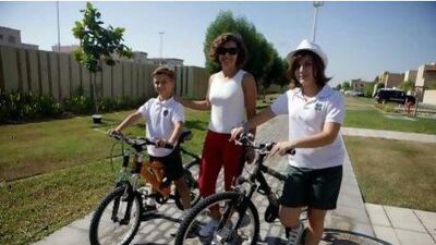 Mother-of-two Maridel Menino has brought her healthy attitude with her from Mexico. She ensures her two children Miguel Alvarez, 9, and Pamela Alvarez, 11, cycle to school in Khalifa City A each day. Sammy Dallal / The National