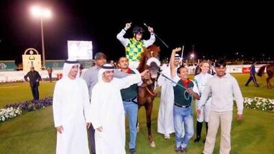 Naseem, ridden by Harry Bentley, won The President of the UAE Cup in a photo finish against last year's winner Nieshan last night. Jake Badger for The National