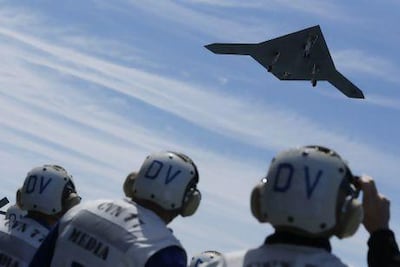 An X-47B pilot-less drone launches for the first time off an aircraft carrier, the 'USS George H W Bush', in the Atlantic Ocean off the coast of Virginia.