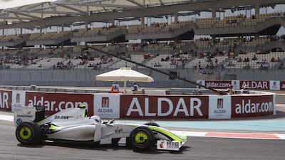 Rubens Barrichello rounds the hair pin before the long straight on the first practice session yesterday. Stephen Lock / The National