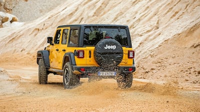 A Wrangler driver tries to hang on to the car's back end on the test track.