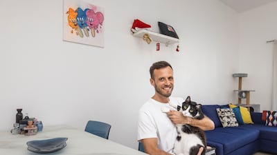 Chris Howlett and his wife share a two-bedroom apartment in Al Barsha with their three cats. All photos: Antonie Robertson / The National