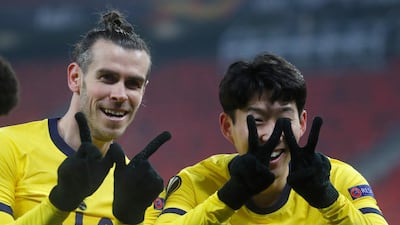 Tottenham's Son Heung-min, right, celebrates with Gareth Bale after scoring his side's first goal during their 4-1 Europa League last-32 win over Wolfsberger at the Puskas Arena in Budapest, on Thursday, February 18. AP