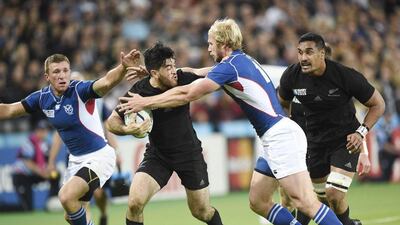 New Zealand's Nehe Milner-Skudder is tackled by Namibia's Conrad Marais during their Rugby World Cup pool contest on Thursday night. Facundo Arrizabalaga / EPA / September 24, 2015