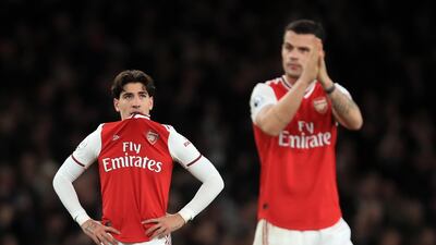 Hector Bellerin, left, and Granit Xhaka after Arsenal's defeat to Brighton & Hove Albion. Getty Images
