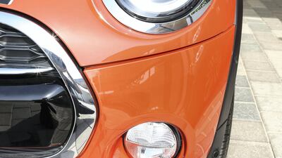 The three-door Mini in solaris orange. Mini