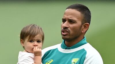 Usman Khawaja and daughter Aish. EPA