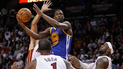 Golden State Warriors' Harrison Barnes shoots against Miami Heat.