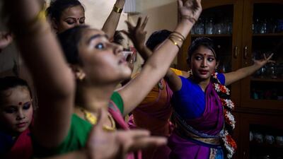 Dance students perform during a Bharatnatyam dance rehearsal under the tutelage of guru Aayurshi Neeraj at her residence in New Delhi on November 11, 2016. Chandan Khanna / AFP
