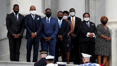 The flag-draped casket of John Lewis is carried by a joint services military honour guard to lie in state in Washington, DC. REUTERS