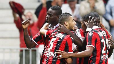 Mario Balotelli, left, of Nice celebrates with his teammates after scoring against Monaco on Wednesday night. Sebastien Nogier / EPA / September 21, 2016