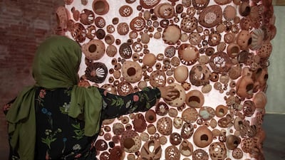 Visitors can touch the leather objects, triggering an audio component that plays the sounds of the production process. Courtesy Misk Art Institute