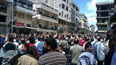 Syrian anti-government protesters shout slogans as they gather in the coastal town of Banias on May 6.