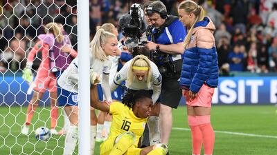 Nigeria goalkeeper Chiamaka Nnadozie is consoled by England players after the shoot-out. Getty