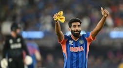 India's Jasprit Bumrah celebrates after taking the wicket of New Zealand's captain Mitchell Santner during the 2026 ICC Men's T20 Cricket World Cup final match between India and New Zealand at the Narendra Modi Stadium in Ahmedabad on March 8, 2026. (Photo by Dibyangshu SARKAR / AFP)