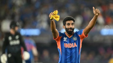 India's Jasprit Bumrah celebrates after taking the wicket of New Zealand's captain Mitchell Santner during the 2026 ICC Men's T20 Cricket World Cup final match between India and New Zealand at the Narendra Modi Stadium in Ahmedabad on March 8, 2026. (Photo by Dibyangshu SARKAR / AFP)