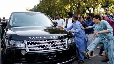 Supporters of the PTI beat the car of government lawyer and petitioner Mohsin Nawaz Ranjha, during a protest outside the Election commission office in Islamabad. AFP