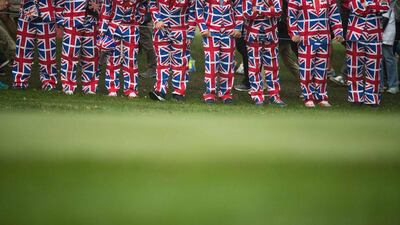 British golf fans watch during the Ryder Cup morning foursomes. Jim Watson / AFP