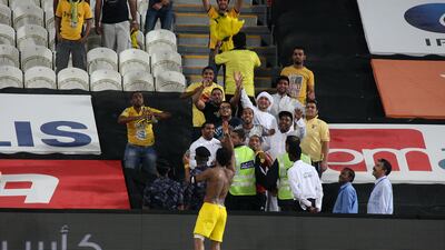 Waheed Ismail celebrates with Al Wasl supporters after the last gasp winner against Jazira gave the Dubai said victory in their Etisalat Cup tie. Pawan Singh / The National