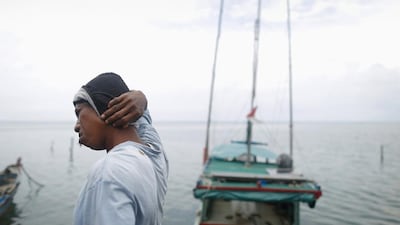 Rusli Suhardi, a leader of the local fishermen’s cooperative, reacts after returning to shore in Ranai on Natuna Besar. Tim Wimborne / Reuters