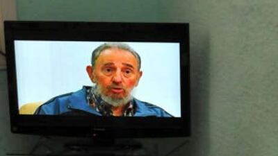 Fidel Castro wore a dark blue track suit top over a plaid shirt. He looked relaxed and lucid, though his voice was raspy and he spoke slowly.