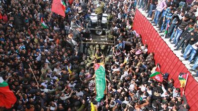 Thousands of Palestinians on Monday attended the funeral of Arafat Jaradat, a 30-year-old Palestinian man who died under disputed circumstances in Israeli custody. Nasser Shiyoukhi / AP Photo
