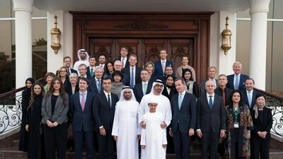 Dr Andreas Jacobs, chairman of INSEAD, fourth right, Sheikh Mohammed bin Zayed, Crown Prince of Abu Dhabi and Deputy Supreme Commander of the UAE Armed Forces, fifth right, Sheikh Zayed bin Abdullah bin Zayed, front fifth right, and Dr Ali Rashid Al Nuaimi, Director General of Abu Dhabi Education Council and Abu Dhabi Executive Council Member, sixth right, stand for a photograph with INSEAD staff members, during a Sea Palace barza. Hamad Al Kaabi / Crown Prince Court - Abu Dhabi