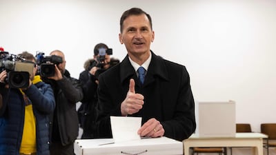 Presidential candidate of Croatian Democratic Union (HDZ) Dragan Primorac gesturea as he casts his ballot at a polling station in Zagreb. AFP