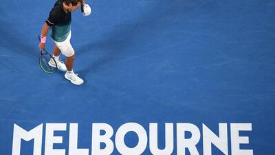 Lucas Pouille walks to receive serve from Novak Djokovic. AP Photo