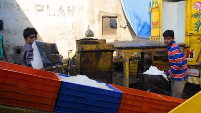 Men collect ice at Sassoon Docks. The dock is one of the oldest docks in Mumbai and helped to establish the cotton trade. Subhendu Sarkar / Getty Images