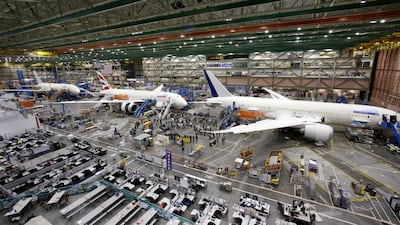 A line of Boeing 787 jets sit on the floor nearing completion at the company's production plant in Everett, Wash. The company updated its forecast of the airplane market on October 6, 2020. It remains upbeat about long-term prospects driven by increasing air travel in Asia. AP.