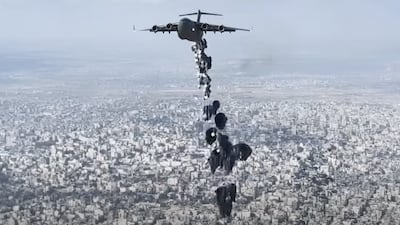 Military personnel flew over the Gaza Strip to drop aid for war-ravaged Palestinians. Photo: Wam