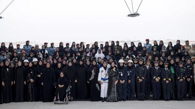 Sheikh Mohammed stands with dozens of women honoured on Emirati Women's Day. Rashed Al Mansoori / Crown Prince Court - Abu Dhabi