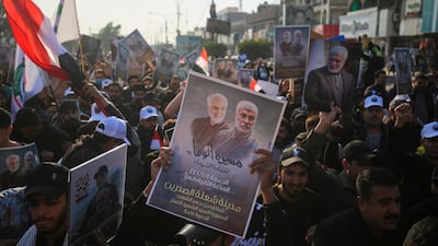 Iraqi supporters of the Hashed al-Shaabi paramilitary carry portraits of Iraqi commander Abu Mahdi al-Muhandis and Iranian Revolutionary Guards commander Qasem Soleimani during a demonstration in Baghdad's western Shoala neighbourhood. AFP