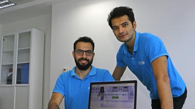 Ali Ozcan, left, and Kerem Kuyucu of Justmop.com, used developers in Turkey to build their site and app. Jeffrey E Biteng / The National