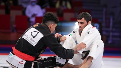 UAE's Omar Al Fadhli, in white, on his way to victory against Leonardo Mario at the Abu Dhabi World Professional Jiu-Jitsu Championship, on November 18, 2021. Pawan Singh / The National
