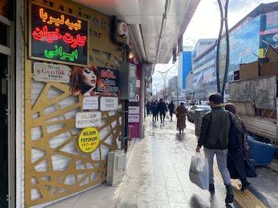 Shop bear signs in Farsi in the Turkish border city of Van, where Iranians are frequent visitors. Lizzie Porter for The National