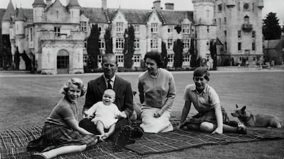 Making a happy group on the lawns at Balmoral, are the Queen, the Duke of Edinburgh and their three children Princess Anne, Prince Charles and baby Prince Andrew, on his father's knees. Getty Images
