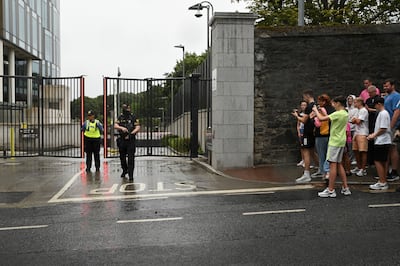 People gather outside the Special Criminal Court in Dublin before a hearing for alleged Irish crime boss Daniel Kinahan. Reuters