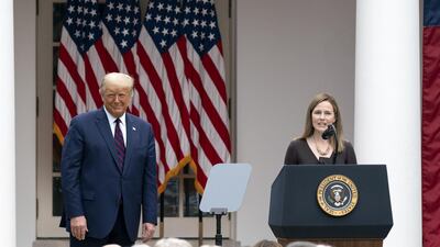 Amy Coney Barrett, US President Donald Trump's nominee for associate justice of the Supreme Court, speaks as President Donald Trump listens during an announcement ceremony in the Rose Garden of the White. Bloomberg