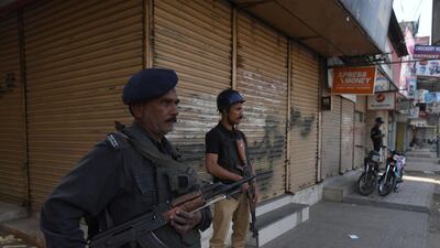 Pakistani policemen guard a closed market during protests in Karachi on November 2, 2018 against the acquittal of a Christain woman for blasphemy. AFP