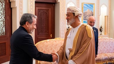 Oman's Sultan Haitham receives Iran's Foreign Minister Abbas Araghchi, left, and Parliament Speaker Mohammad Bagher Ghalibaf in Muscat. AFP