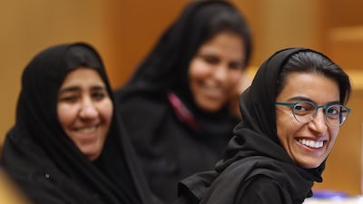 FNC member Noura Alkaabi, right, Dr Muna Juma Albahar, centre, and Aishah Ahmed Al Yammahi at an FNC meeting. Delores Johnson / The National