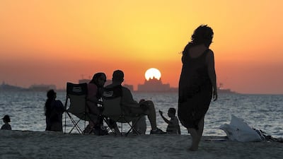 UAE residents enjoy the start of the long weekend at the Kite Beach in Dubai. Pawan Singh / The National