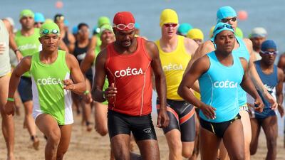 Participants compete in the UAE'S 10th National Lifeguard Championship competition at Al Aqah Beach Resort in Fujairah. Satish Kumar / The National
