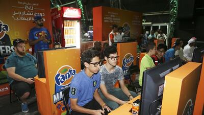 Gamers play video games at the IGN Convention Abu Dhabi at Du Forum in Abu Dhabi. Sarah Dea / The National