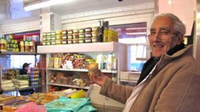 Aziz Hamdame, owner of the Boucherie de la Place, holds a jar of halal foie gras.